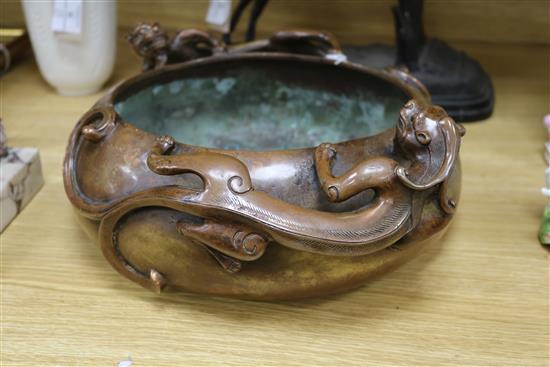 A large Chinese bronze dragon censer, Xuande mark length 38cm